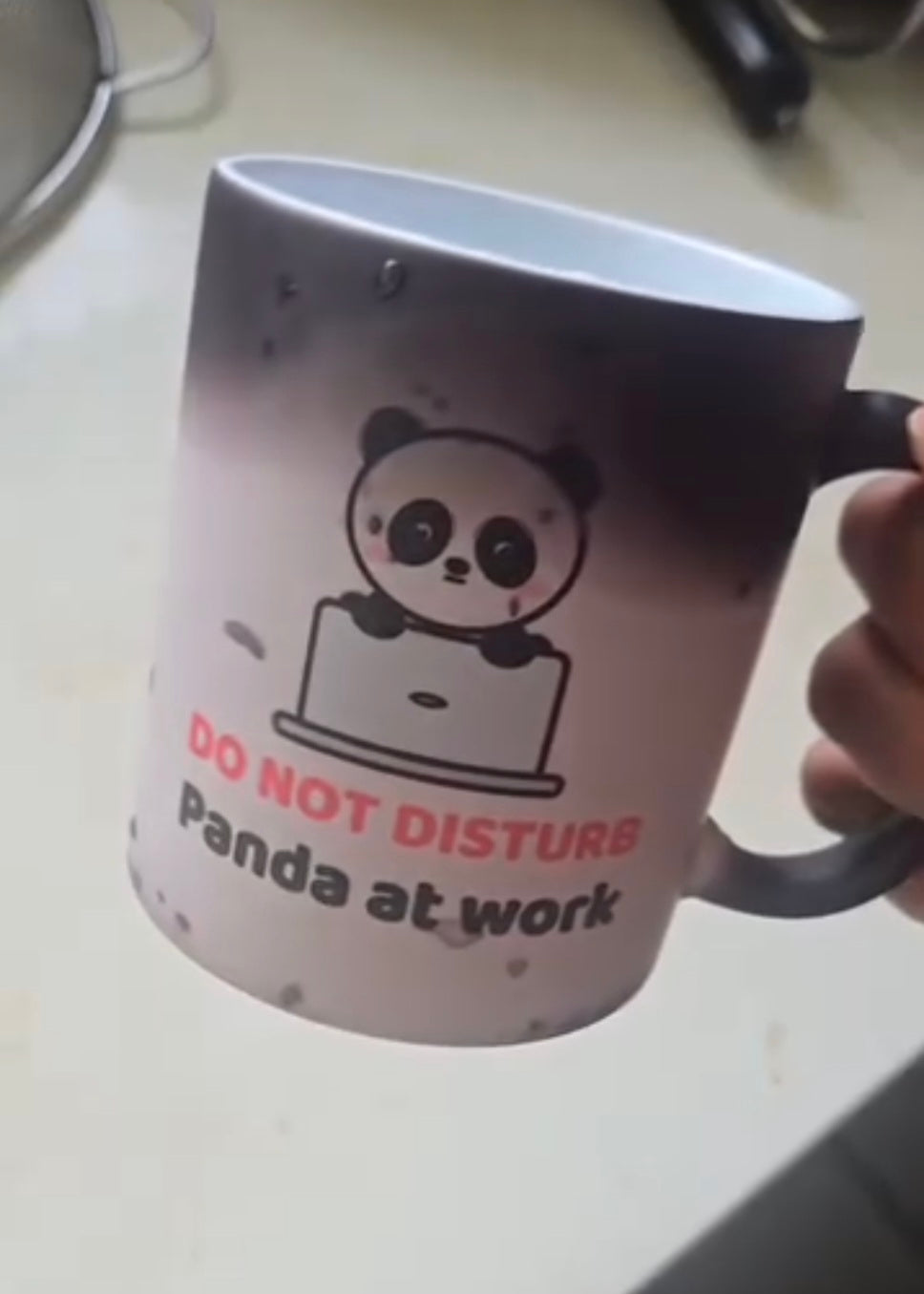 Customer photo: Panda at Work black mug with the panda design (shared by Hargun)